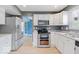 Well-equipped kitchen featuring modern appliances, ample countertop space, and a seamless flow to other rooms at 65 Millet Ct, Danville, IN 46122