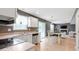 Open kitchen and dining area featuring a dining table set and views into a cozy living space at 65 Millet Ct, Danville, IN 46122