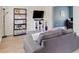 Comfortable living room featuring a cozy gray couch and a stylish display cabinet at 65 Millet Ct, Danville, IN 46122