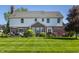 Two-story home with well-kept lawn, back patio with furniture, and brick and siding exterior at 6649 Braemar S Ave, Noblesville, IN 46062