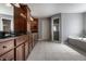 Spacious bathroom features tiled flooring, wood cabinets, soaking tub, and glass-enclosed shower at 6649 Braemar S Ave, Noblesville, IN 46062