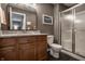 Bathroom featuring wood vanity, granite countertop, and glass shower at 6649 Braemar S Ave, Noblesville, IN 46062