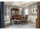Classic dining room with a large wooden table, traditional furnishings, and sophisticated lighting fixture at 6649 Braemar S Ave, Noblesville, IN 46062