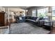 Cozy living room with large sectional sofa, hardwood floors, and bright natural light at 6649 Braemar S Ave, Noblesville, IN 46062