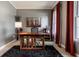 Home office space with a wooden desk, modern decor, a soft rug, and natural light from a window at 6649 Braemar S Ave, Noblesville, IN 46062