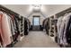 Huge walk-in closet with built-in shelving and ample storage space at 6649 Braemar S Ave, Noblesville, IN 46062