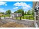 Back deck overlooking the backyard and a detached garage, ideal for outdoor living at 6838 Five Points Rd, Indianapolis, IN 46259
