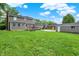 Expansive backyard features a well-maintained lawn, wooden deck, and detached garage space at 6838 Five Points Rd, Indianapolis, IN 46259