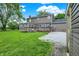 Spacious backyard featuring a wooden deck and a well-maintained lawn at 6838 Five Points Rd, Indianapolis, IN 46259
