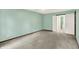 A bright bedroom with an ensuite bathroom features neutral carpeting and an overhead light at 6838 Five Points Rd, Indianapolis, IN 46259