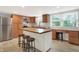 Kitchen with stainless steel appliances, island with butcher block top, and built-in desk at 6838 Five Points Rd, Indianapolis, IN 46259