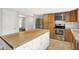 Kitchen with a large island, stainless steel appliances, and light wood cabinetry at 6838 Five Points Rd, Indianapolis, IN 46259