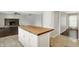 Kitchen with a large island and stainless steel appliances that opens to the living room at 6838 Five Points Rd, Indianapolis, IN 46259