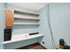 Office area with built-in desk, shelves, and blue walls, perfect for work or study at 6838 Five Points Rd, Indianapolis, IN 46259
