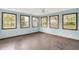 Sunroom features many windows and natural light, making it a cozy living space at 6838 Five Points Rd, Indianapolis, IN 46259