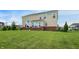 Wide shot showing the exterior of a two-story home with large backyard. Large windows for great natural light at 7046 Allegiance Ct, Indianapolis, IN 46259