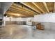 Unfinished basement with open ceiling, concrete flooring, and partial wall coverings, ready for customization at 7046 Allegiance Ct, Indianapolis, IN 46259