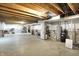 Wide view of unfinished basement with open ceiling joists, concrete floor, and utility equipment visible at 7046 Allegiance Ct, Indianapolis, IN 46259