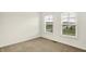 Neutral bedroom with two windows providing natural light at 7046 Allegiance Ct, Indianapolis, IN 46259