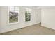 Bright bedroom with two windows overlooking the neighborhood at 7046 Allegiance Ct, Indianapolis, IN 46259