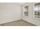 Neutral bedroom features plush carpeting, two windows providing natural light, and a cozy atmosphere at 7046 Allegiance Ct, Indianapolis, IN 46259