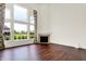 Hardwood floors, a fireplace, and expansive windows create a bright and inviting living space at 7046 Allegiance Ct, Indianapolis, IN 46259