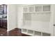 Bright mudroom featuring a white storage bench with hooks and shelving at 7046 Allegiance Ct, Indianapolis, IN 46259