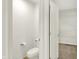 Powder room with toilet adjacent to walk-in closet at 7046 Allegiance Ct, Indianapolis, IN 46259