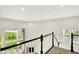 View from staircase landing with bright windows and natural light at 7046 Allegiance Ct, Indianapolis, IN 46259