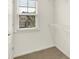 Walk-in closet featuring window with neighborhood views and wire shelving at 7046 Allegiance Ct, Indianapolis, IN 46259