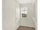 Walk-in closet features window with neighborhood views and wire shelving at 7046 Allegiance Ct, Indianapolis, IN 46259