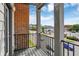 Balcony featuring black railings and views of the surrounding neighborhood and downtown area at 727 N Illinois St # 202, Indianapolis, IN 46204