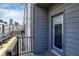 Balcony featuring black railings and views of the surrounding neighborhood and downtown skyline at 727 N Illinois St # 202, Indianapolis, IN 46204