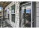 Balcony view with railings and exterior doors showcasing the building's façade and nearby scenery at 727 N Illinois St # 202, Indianapolis, IN 46204