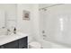 This bathroom features a modern vanity and a tub and shower with a modern shower head at 727 N Illinois St # 202, Indianapolis, IN 46204