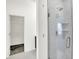 This bathroom features a stand-up shower and a closet with wire shelving at 727 N Illinois St # 202, Indianapolis, IN 46204