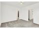 This bedroom features neutral carpeting and two doorways, leading to a closet and bathroom at 727 N Illinois St # 202, Indianapolis, IN 46204