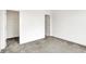 This bedroom features neutral carpeting and two doorways, likely leading to closets at 727 N Illinois St # 202, Indianapolis, IN 46204