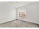 This bedroom features neutral carpeting, a modern window, and ample natural light at 727 N Illinois St # 202, Indianapolis, IN 46204