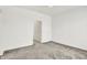 This bedroom features neutral carpeting and two doorways, likely leading to closets or bathrooms at 727 N Illinois St # 202, Indianapolis, IN 46204
