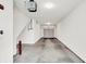 Spacious garage with concrete floors, white walls, and an automatic door for easy access at 727 N Illinois St # 202, Indianapolis, IN 46204