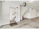 View of the garage with a door leading to a stairwell and concrete floors providing utility at 727 N Illinois St # 202, Indianapolis, IN 46204