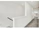 Upper hallway featuring carpet, white walls, and an abundance of natural light at 727 N Illinois St # 202, Indianapolis, IN 46204