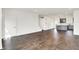 Expansive living area with an open staircase and an adjoining modern kitchen at 727 N Illinois St # 202, Indianapolis, IN 46204