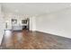 Open-concept living area with hardwood floors flowing into the modern kitchen at 727 N Illinois St # 202, Indianapolis, IN 46204