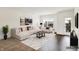 Staged living room featuring a plush sectional sofa and modern decor at 727 N Illinois St # 202, Indianapolis, IN 46204
