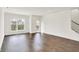 Bright, open-concept living room with hardwood floors and natural light at 727 N Illinois St # 202, Indianapolis, IN 46204