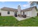 Well-maintained backyard with patio area, complete with a grill and outdoor seating at 7319 Jackie Ct, Indianapolis, IN 46221