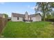 Spacious backyard featuring a patio area, with grill and outdoor seating at 7319 Jackie Ct, Indianapolis, IN 46221