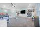 Large bonus room with vaulted ceiling, play area, built-in storage, and ceiling fan at 7319 Jackie Ct, Indianapolis, IN 46221
